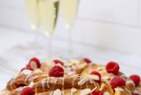 Festive Braided Sourdough Brioche Wreath with Raspberries & Orange Glaze