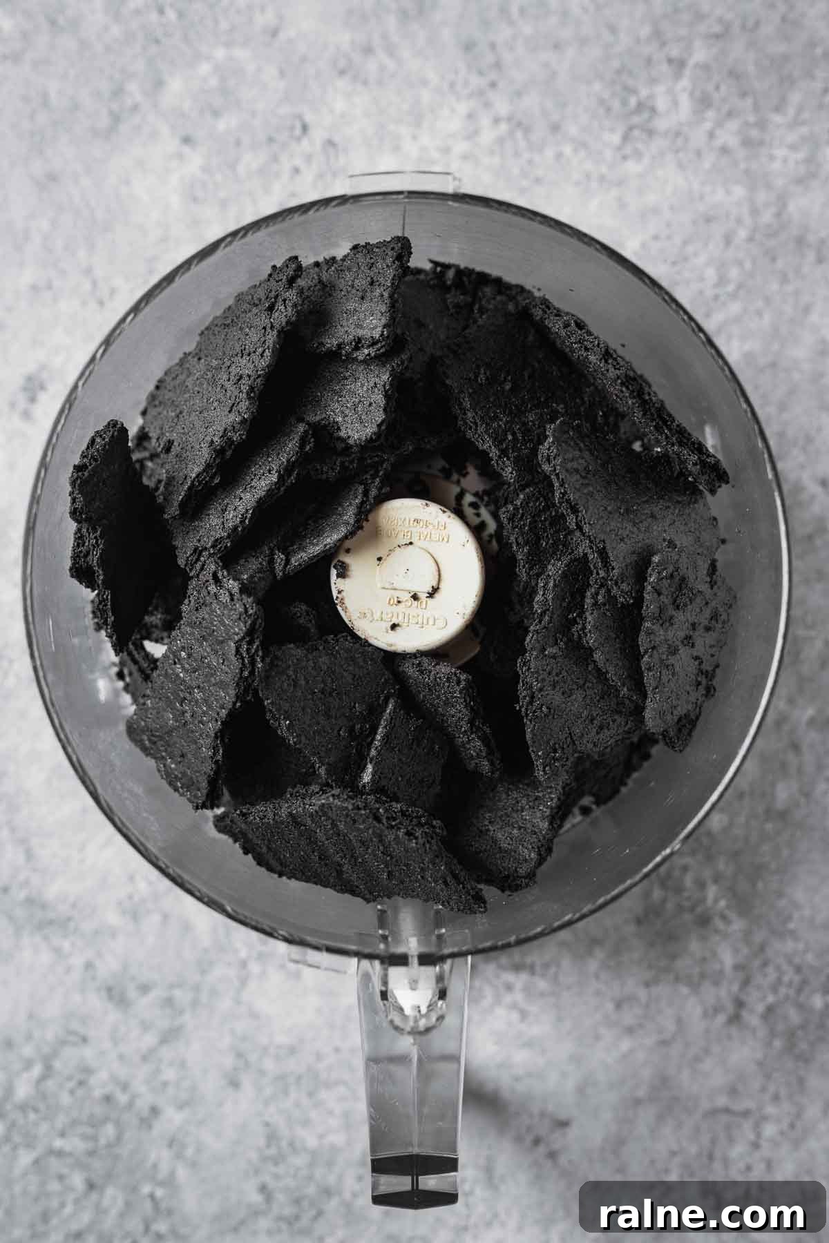 Chocolate Cookie Crust Recipe for Perfect Pie and Cheesecake 5 Chocolate wafer cookie chunks in a food processor.