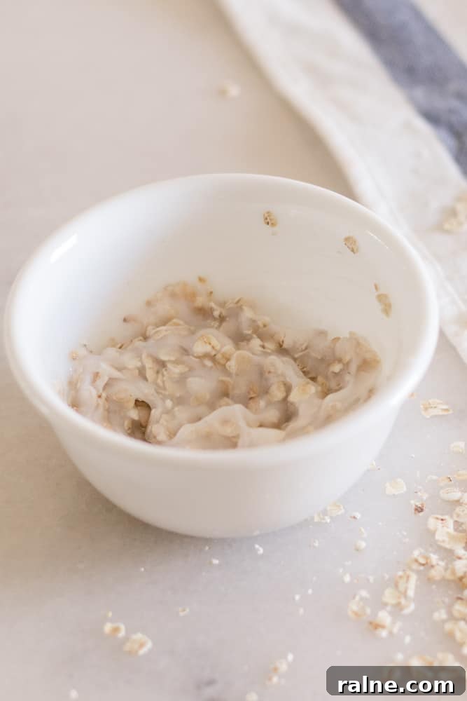 Homemade oatmeal scalp scrub in white bowl.