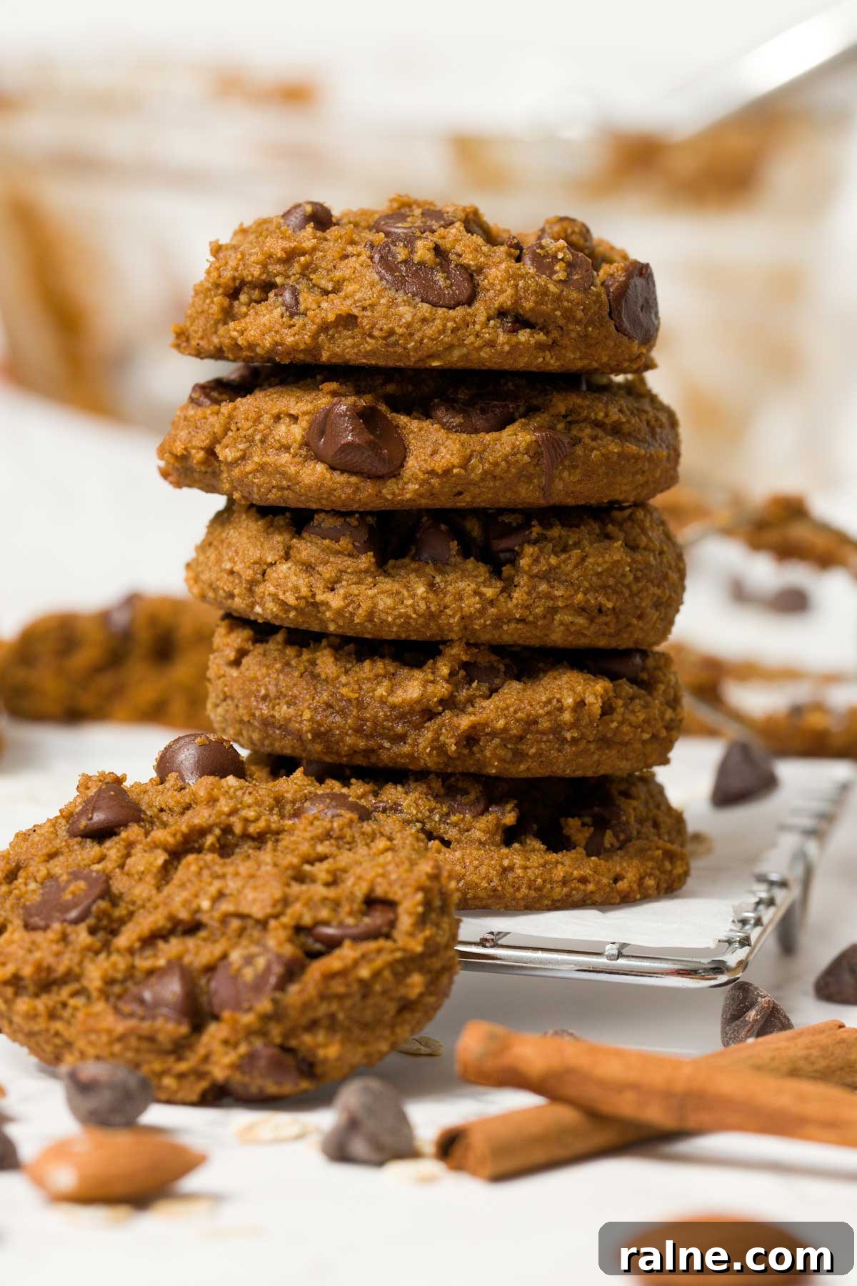 Vegan Gluten-Free Pumpkin Chocolate Chip Cookies 3 Stack of gluten-free chocolate chip pumpkin cookies on a wire rack.