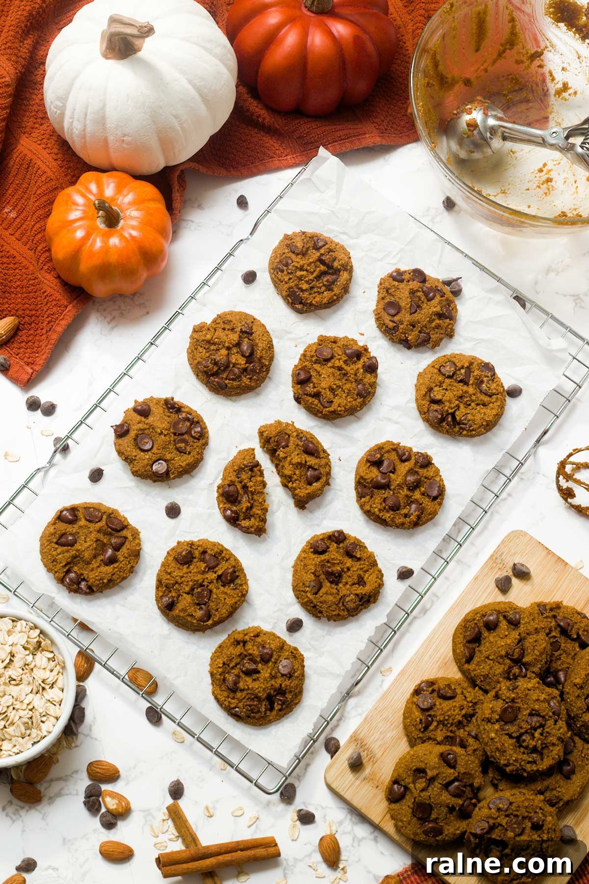 Vegan Gluten-Free Pumpkin Chocolate Chip Cookies 6 Gluten-free chocolate chip pumpkin cookies cooling on a wire rack on parchment paper.
