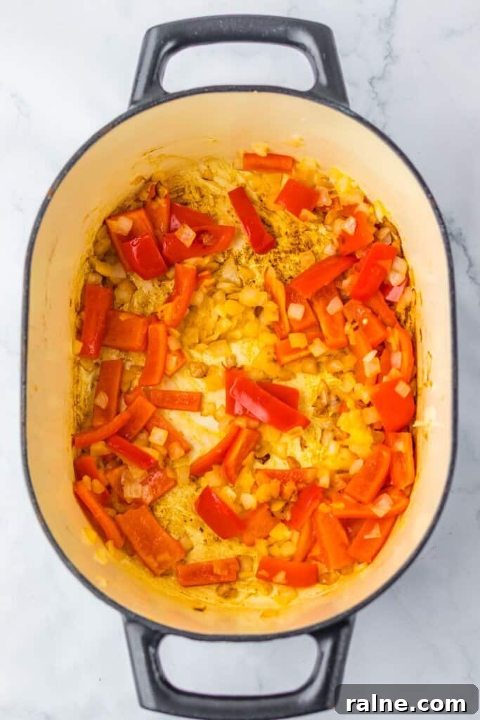 Vegetables being cooked in a large pot.