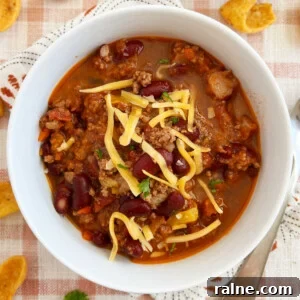Classic Stove-Top Mom’s Chili Recipe for Weeknight Dinners 11 best chili recipe with ground beef and kidney beans cooked on stovetop in white bowl