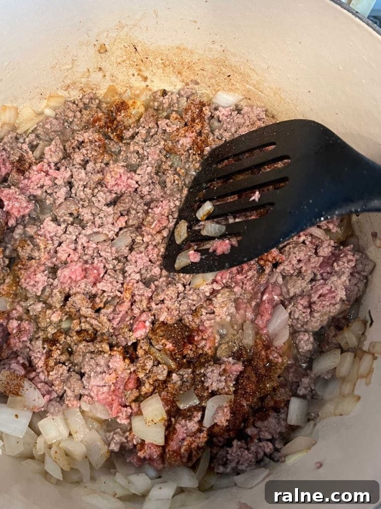 Classic Stove-Top Mom’s Chili Recipe for Weeknight Dinners 5 brown ground beef with onions in dutch oven