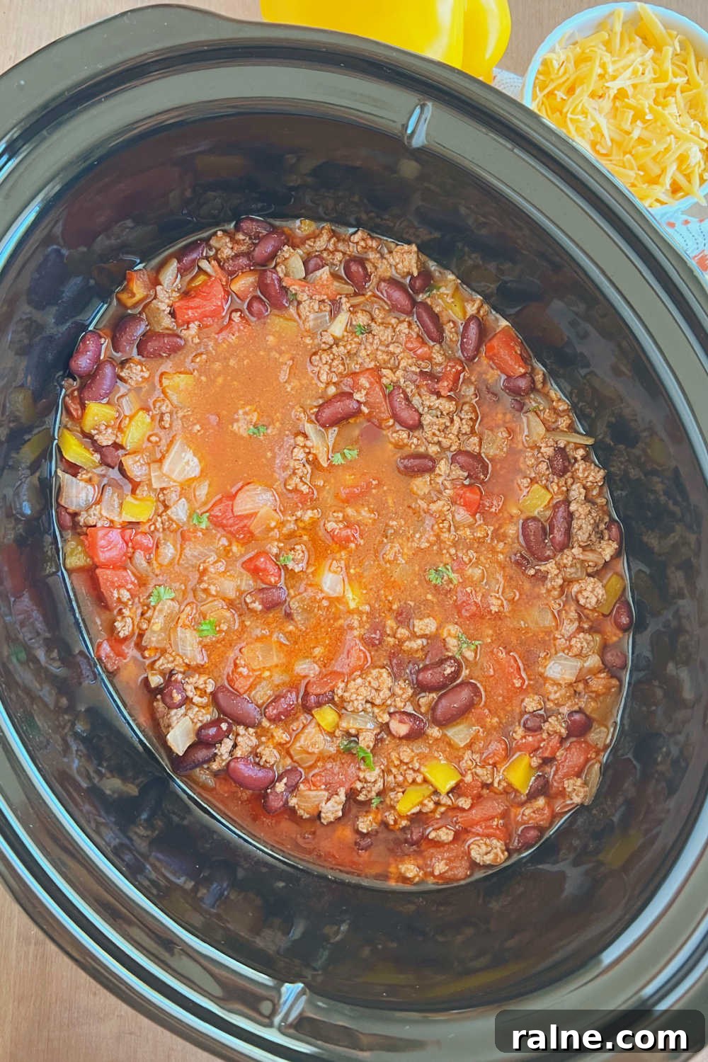 Classic Stove-Top Mom’s Chili Recipe for Weeknight Dinners 9 mild chili with ground beef in crockpot slow cooker