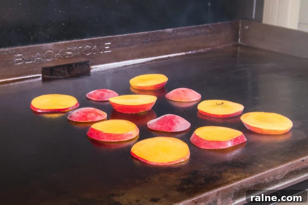 Peaches halved on Blackstone grill