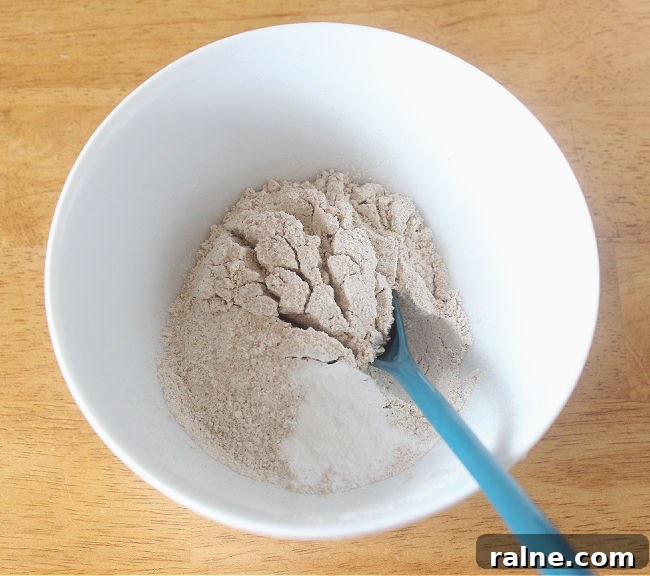 Single-Serve Blueberry Cinnamon Roll Recipe 4 Flour in a white bowl.