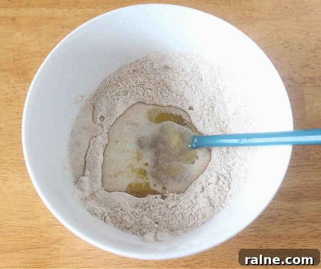 Single-Serve Blueberry Cinnamon Roll Recipe 5 Flour and oil in a bowl.