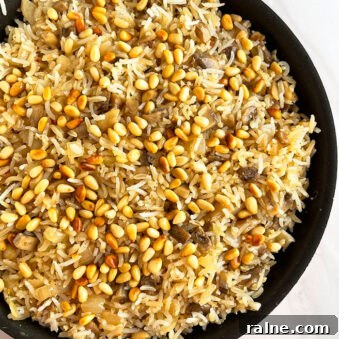 Easy Mushroom Rice in Black Pot on White Background