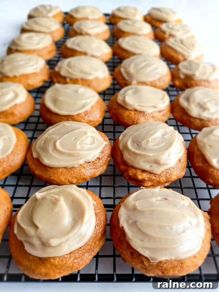 iced pumpkin cookies on cooling rack