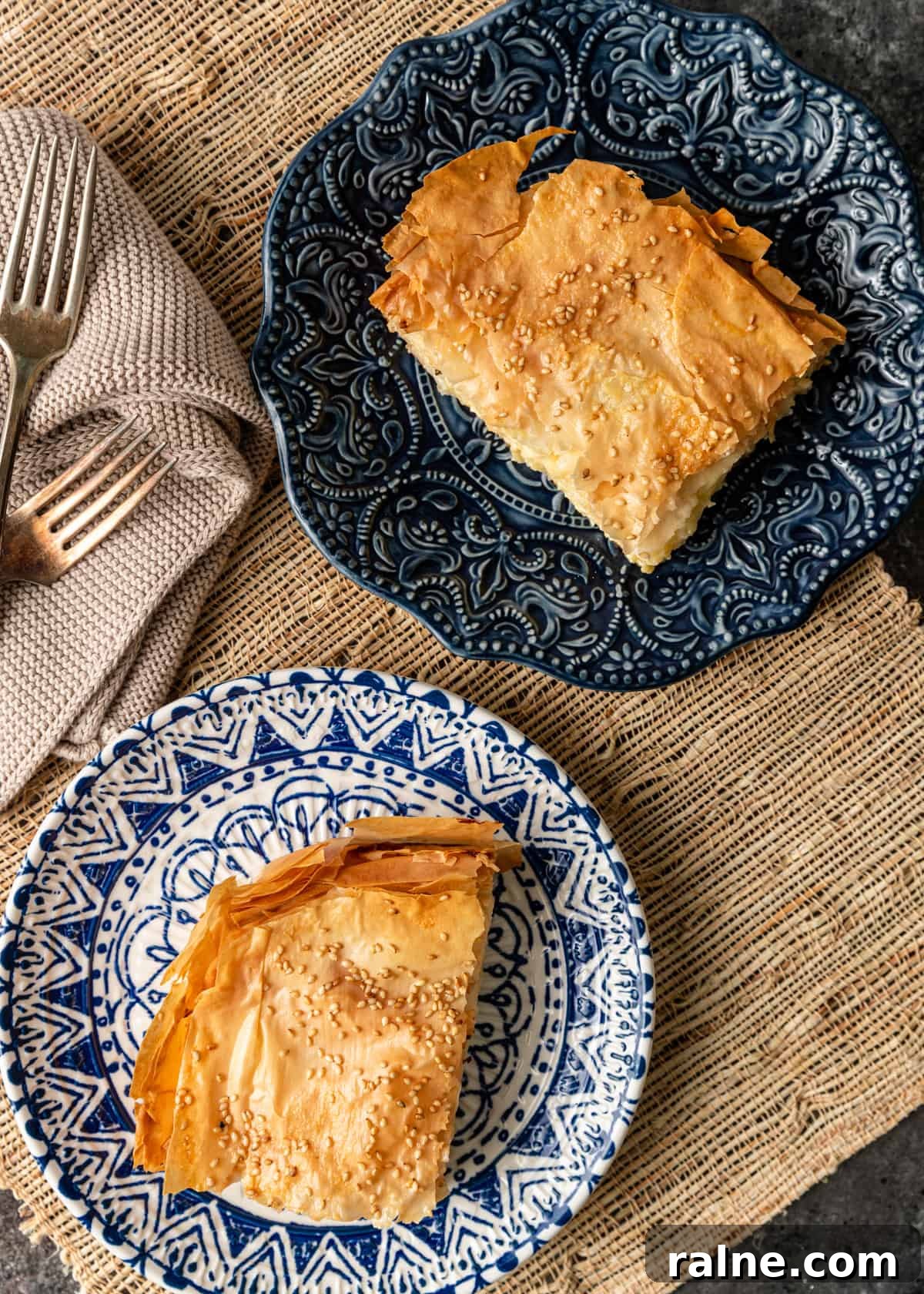 Tiropita: Authentic Greek Cheese Pie Recipe & Tips 13 two pieces of tiropita on plates