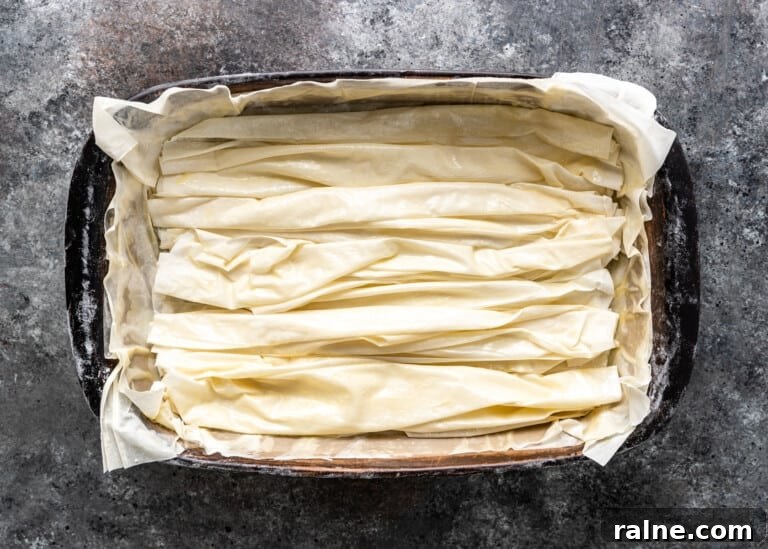 Tiropita: Authentic Greek Cheese Pie Recipe & Tips 8 overhead: crinkled sheets of filo in pan