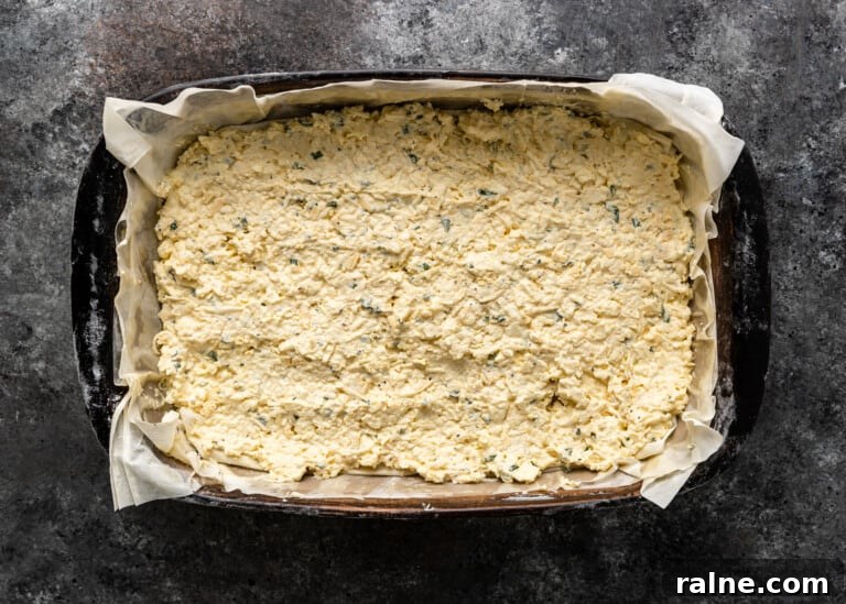 Tiropita: Authentic Greek Cheese Pie Recipe & Tips 9 overhead: cheese and egg filling for greek chese pie in pan
