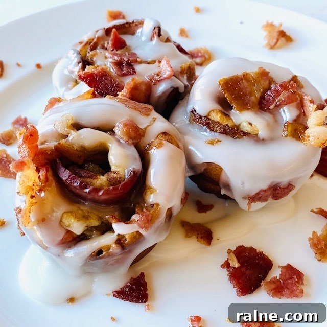 Savory Bacon and Cinnamon Rolls Recipe for Brunch Delight 2 Bacon-Cinnamon-Rolls-on-plate-with-icing-and-bacon-topping