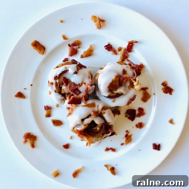 Savory Bacon and Cinnamon Rolls Recipe for Brunch Delight 3 Bacon-Cinnamon-Rolls-on-plate-with-icing-and-bacon-topping