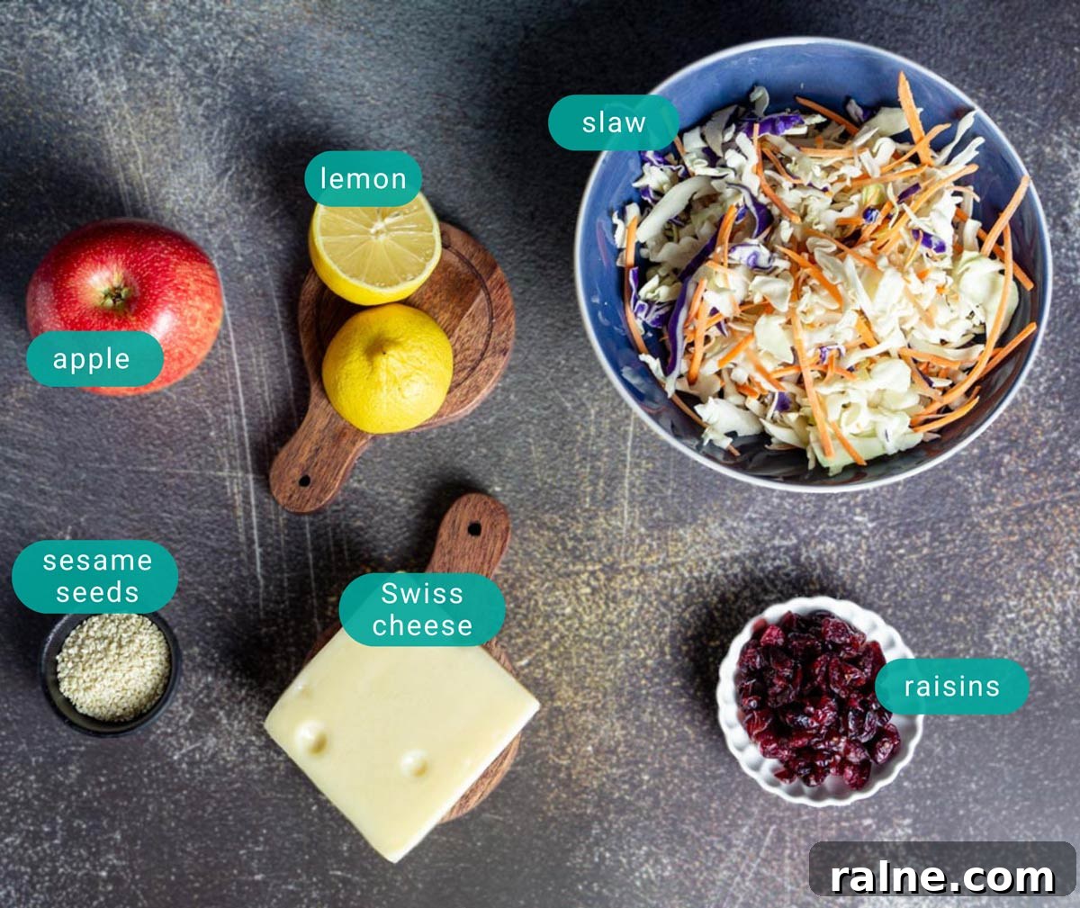 Asian Cabbage and Apple Slaw with Tangy Dressing 3 Ingredients for cabbage apple slaw with cheese on the counter.