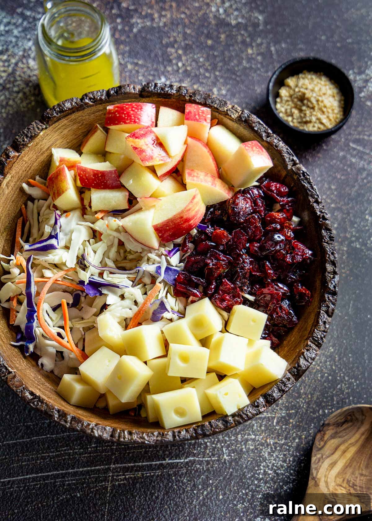 Asian Cabbage and Apple Slaw with Tangy Dressing 7 Asian coleslaw salad ingredients in a bowl.