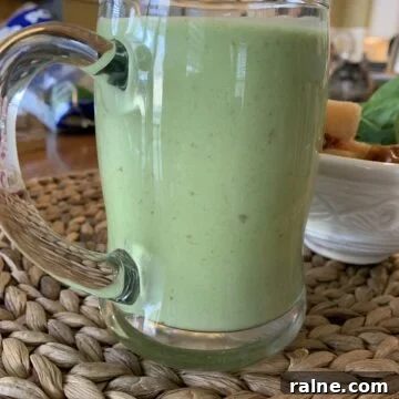 Refreshing Sweet Green Smoothie Recipe for Energy and Glow 13 Smoothie in a large glass cup.