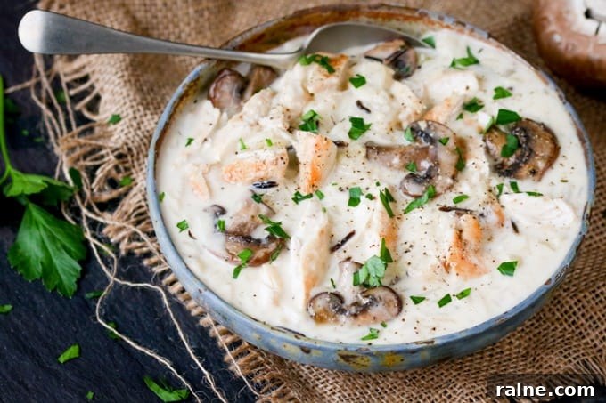 Chicken, Wild Rice & Mushroom Soup - The most comforting creamy soup ever! Savory mushrooms are the perfect veggie for this rich wild rice soup with succulent chicken.