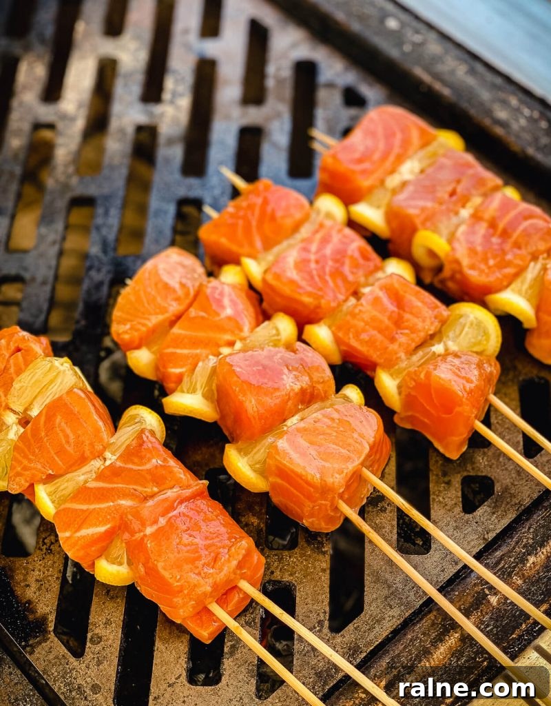 salmon kabobs on the grill over charcoal