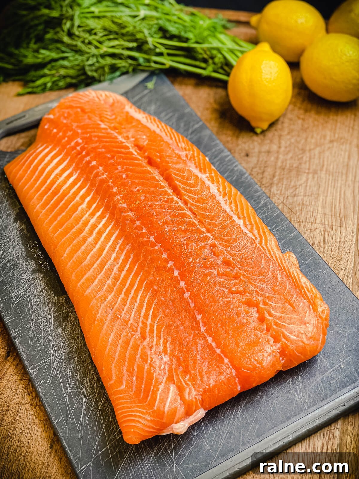 large salmon filet on a cutting board