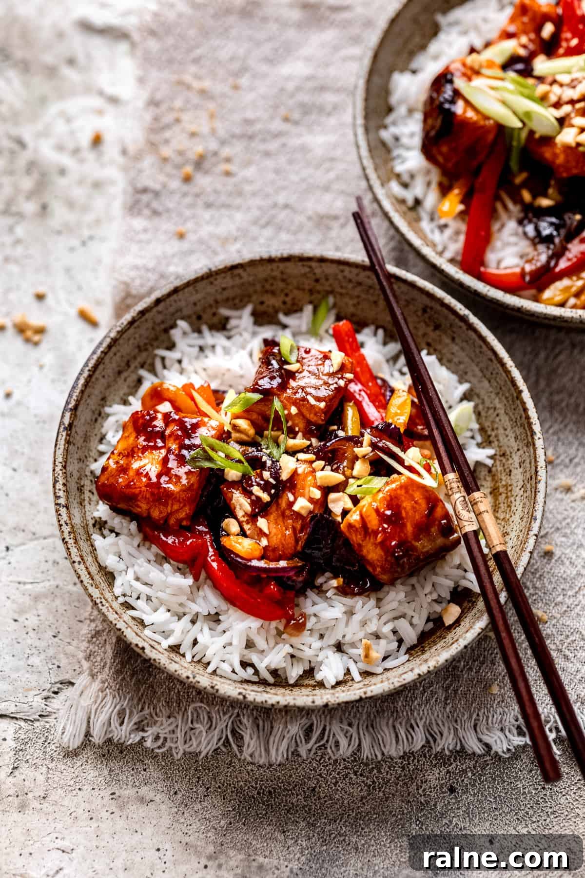 30-Minute Teriyaki Salmon Stir-Fry Recipe for Busy Weeknights 2 Salmon stir fry in a green bowl.