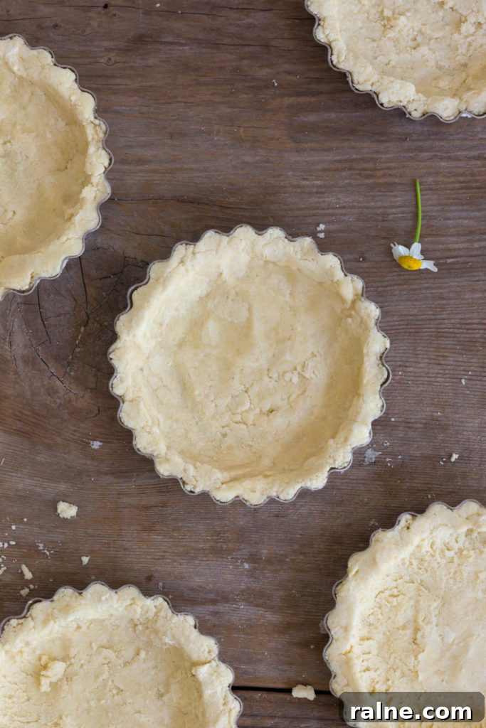 Strawberry Rhubarb Curd Tartlets Recipe for Tangy Spring Desserts 8 shaping tartlets shells