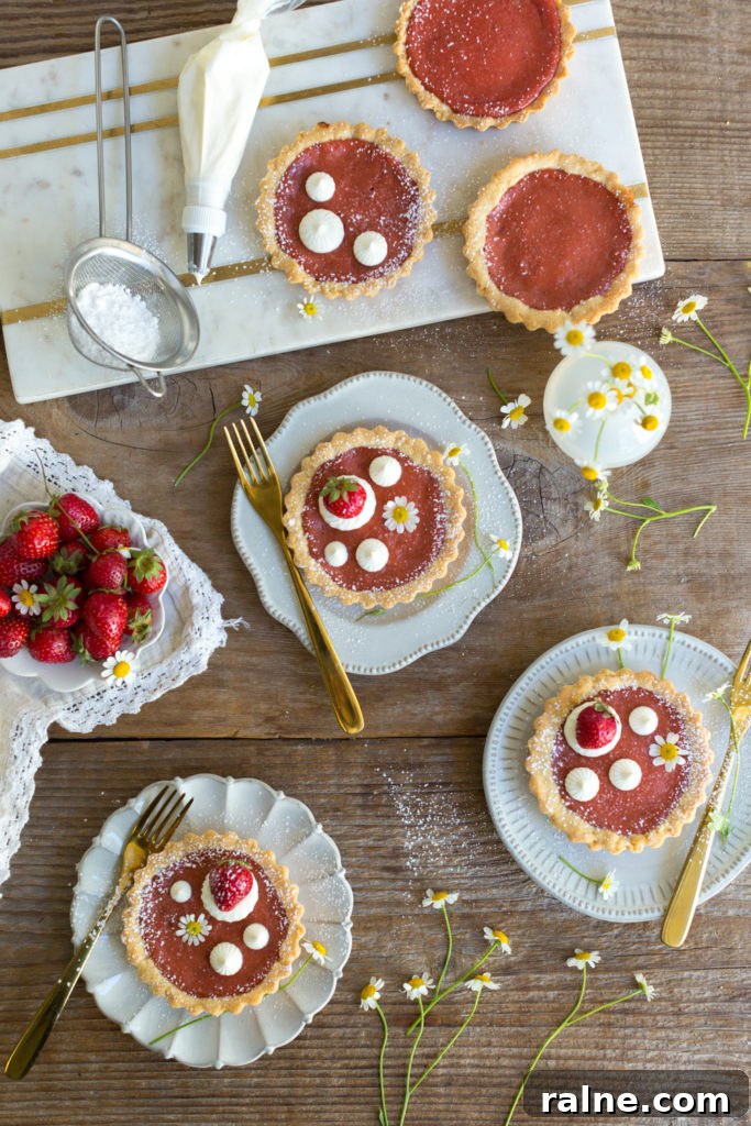 Strawberry Rhubarb Curd Tartlets Recipe for Tangy Spring Desserts 17 Topping Strawberry Rhubarb Curd Tartlets with creme fraiche