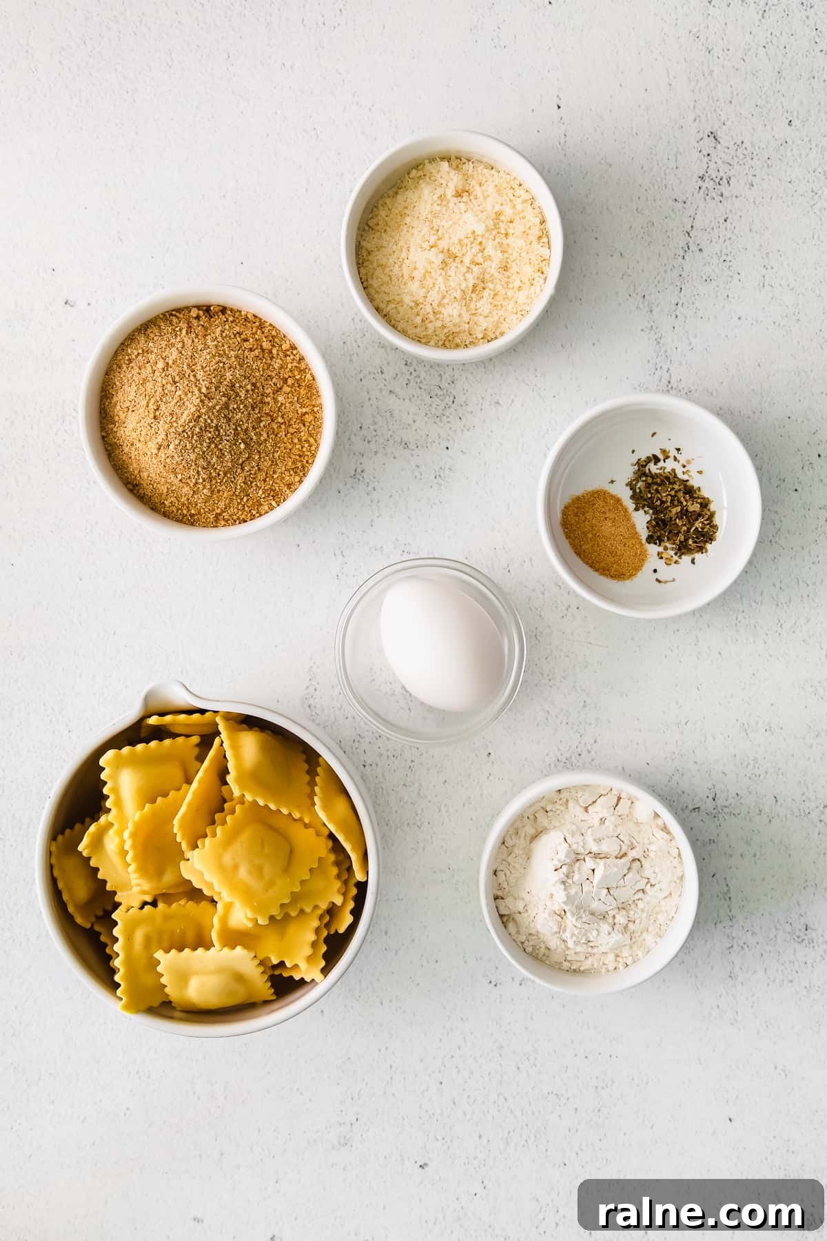 Crispy Air Fryer Ravioli Recipe — Quick Golden Bites 3 Ingredients for the air fryer ravioli in small pinch bowls.