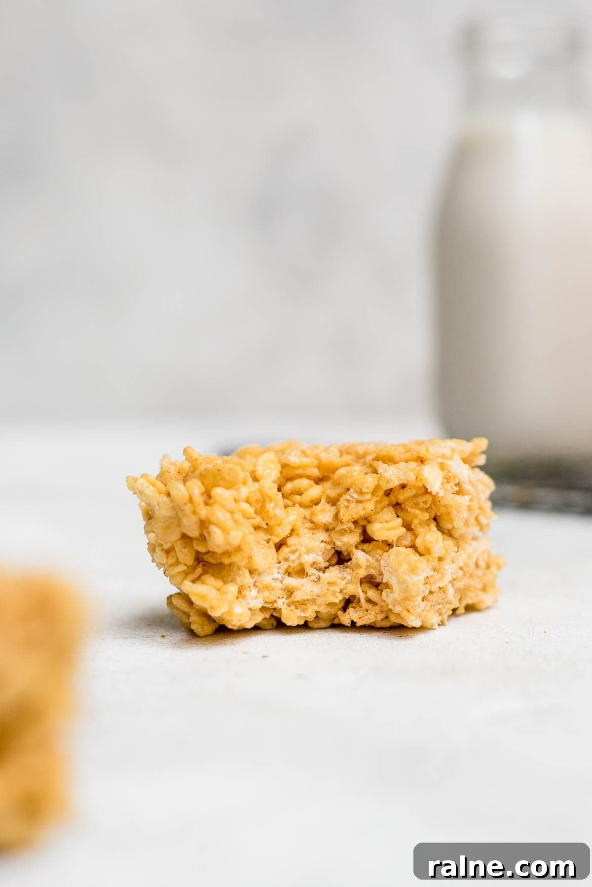 close up pumpkin spice rice krispie treats bitten