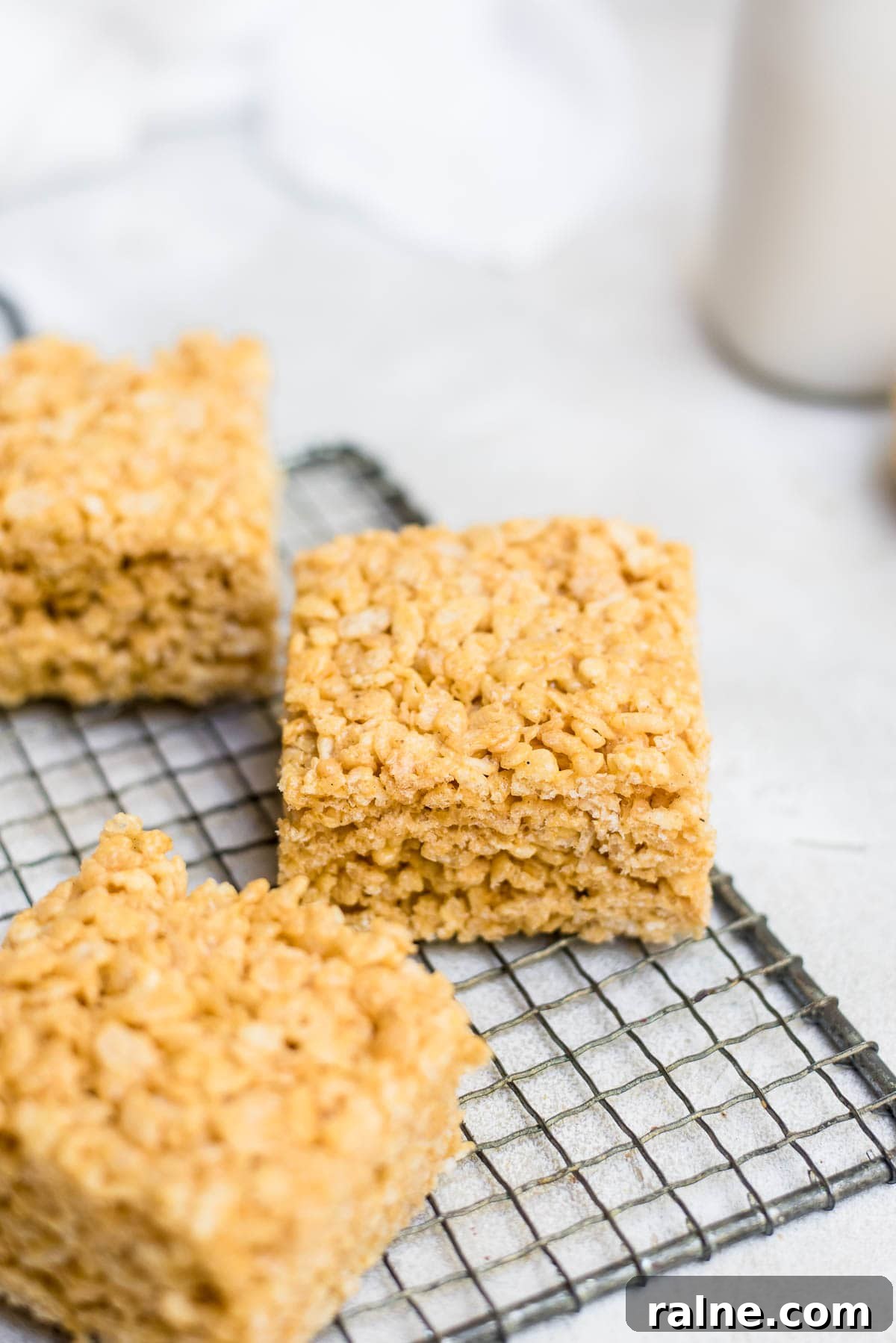 pumpkin rice krispie treat bars on wire rack close up