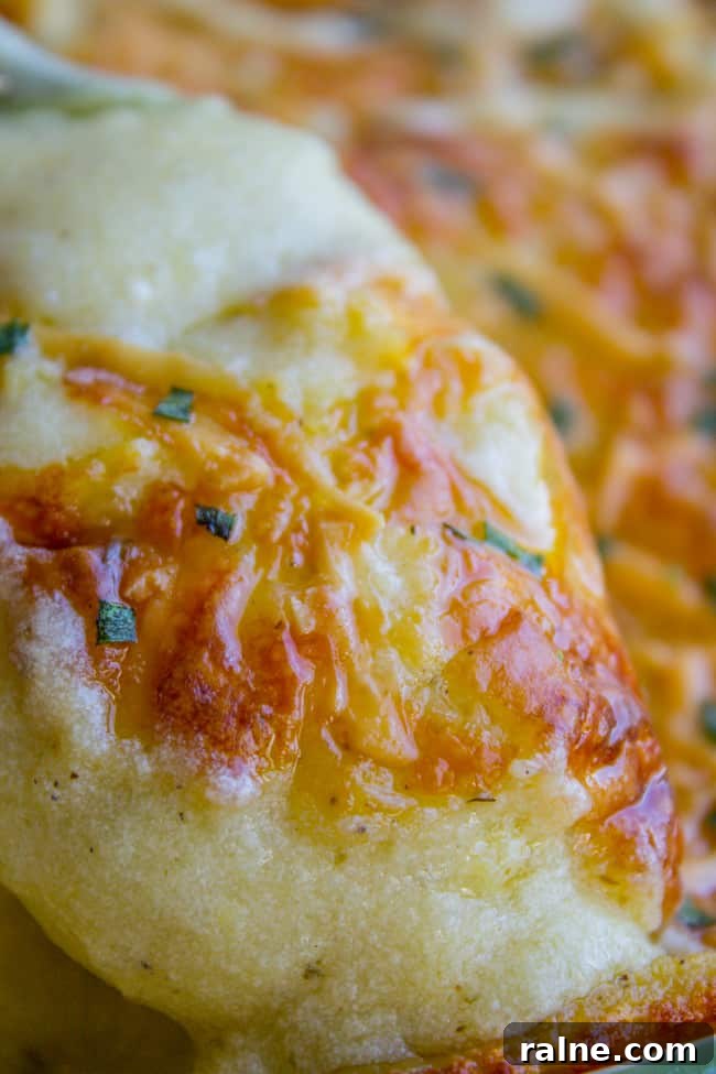 Ina Garten’s Make-Ahead Mashed Potatoes Recipe for Gatherings 3 Close up of cheese topped mashed potatoes.