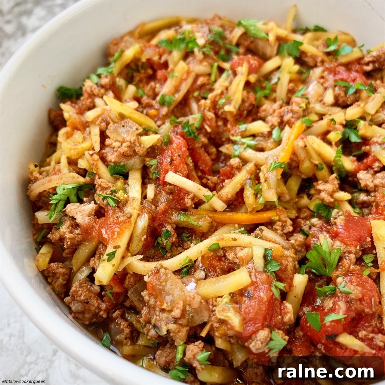 Slow-Cooker Slawghetti: Hearty Sausage Spaghetti Casserole 6 close up pic of slawghetti in a bowl after cooking
