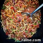 Slawghetti is broccoli slaw cooked in the slow cooker to a soft 'spaghetti' consistency. This is a great low-carb, paleo, and whole30 alternative to spaghetti that's not spaghetti squash.