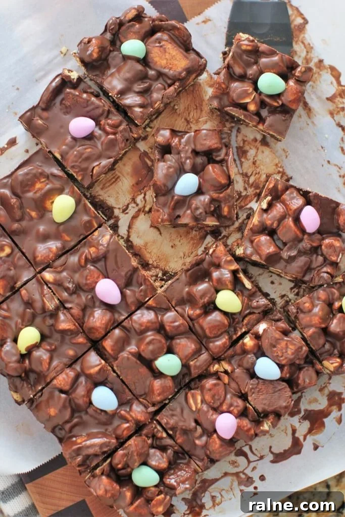 No-Bake Rocky Road Bars Recipe — Quick Chocolate Marshmallow Squares 3 Rocky Road Bars with mini Easter eggs.