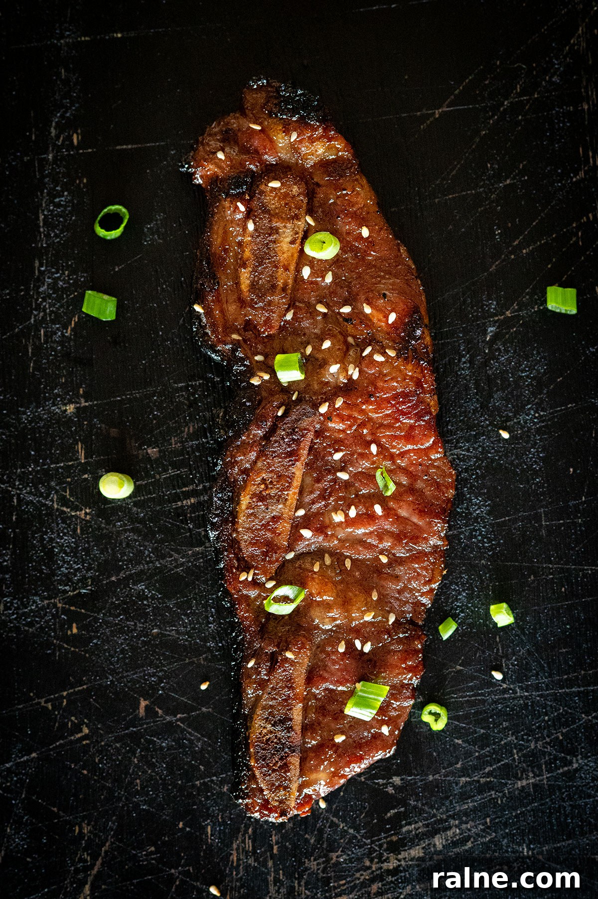 Beef Ribs Guide: Short Ribs, Back Ribs, Flanken & Cooking Tips 11 Kalbi Korean Short Rib on black board.