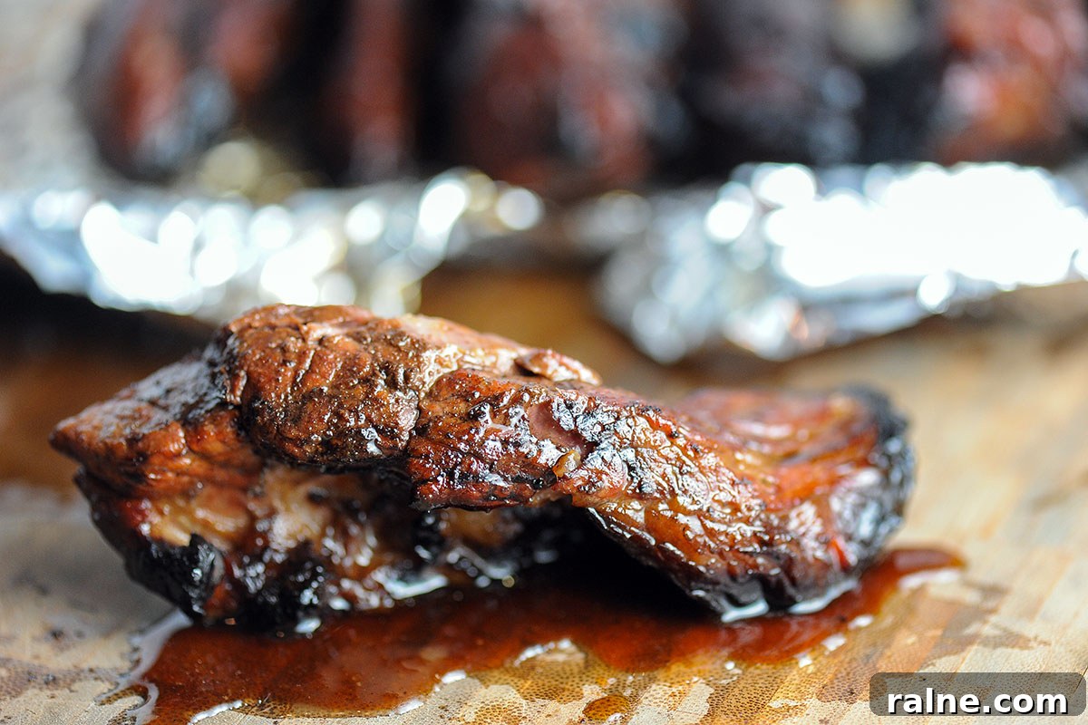 Beef Ribs Guide: Short Ribs, Back Ribs, Flanken & Cooking Tips 13 boneless beef rib on butcher block with juices.