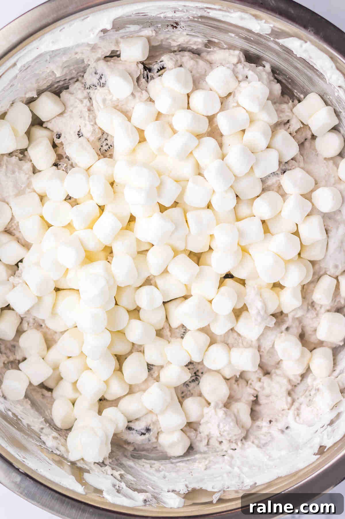 Creamy Oreo Fluff Dessert Recipe: No-Bake Oreo Delight 6 mini marshmallows added to the fluff dessert.
