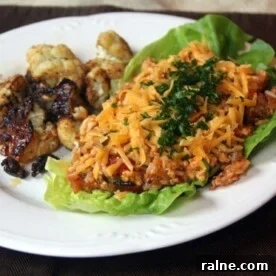 Quick Chicken Dinners for Busy Weeknights 16 Roasted cauliflower with lettuce, ground chicken and cheese on a plate.