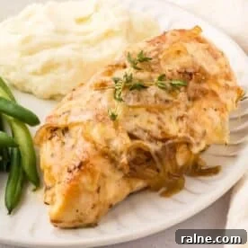 Quick Chicken Dinners for Busy Weeknights 8 A plate with french onion chicken topped with herbs, served with mashed potatoes and green beans.