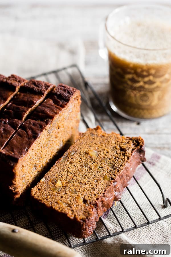 Gingerbread Banana Bread Recipe: Spiced Loaf with Molasses 4 Gingerbread Banana Bread sliced on a serving rack.