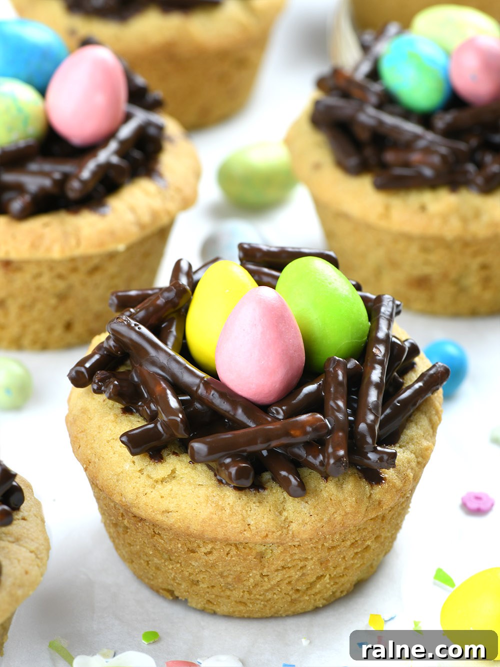 Cookie cup, filled with Nutella and Chocolate-Pretzel Nest with 3 easter eggs (candies) on the top.