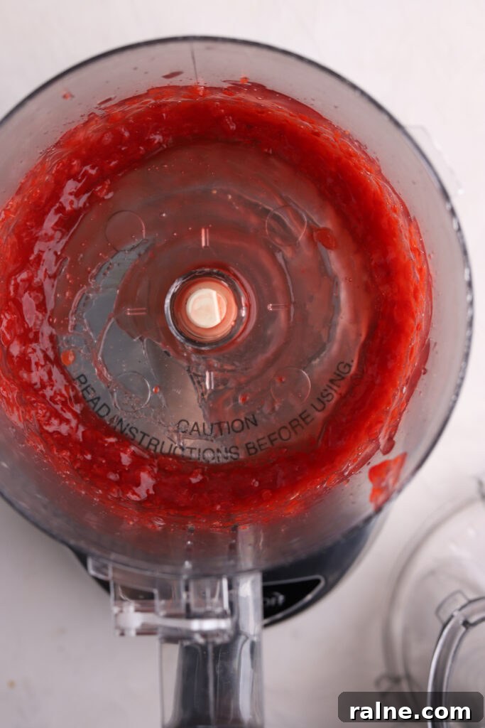 Pie-Inspired Birthday Cake Ideas for a Memorable Celebration 7 A food processor with pureed cherry pie filling in it.