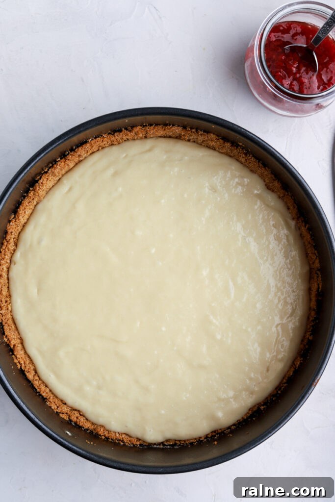 Pie-Inspired Birthday Cake Ideas for a Memorable Celebration 9 A pan with a graham cracker crust and cake batter and a jar of pie filling.