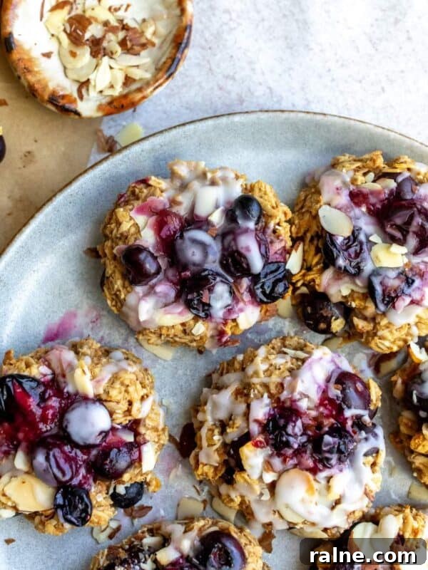 Blueberry oat cookies with icing on top.