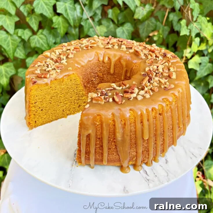 Sliced Pumpkin Bundt Cake on a cake pedestal.
