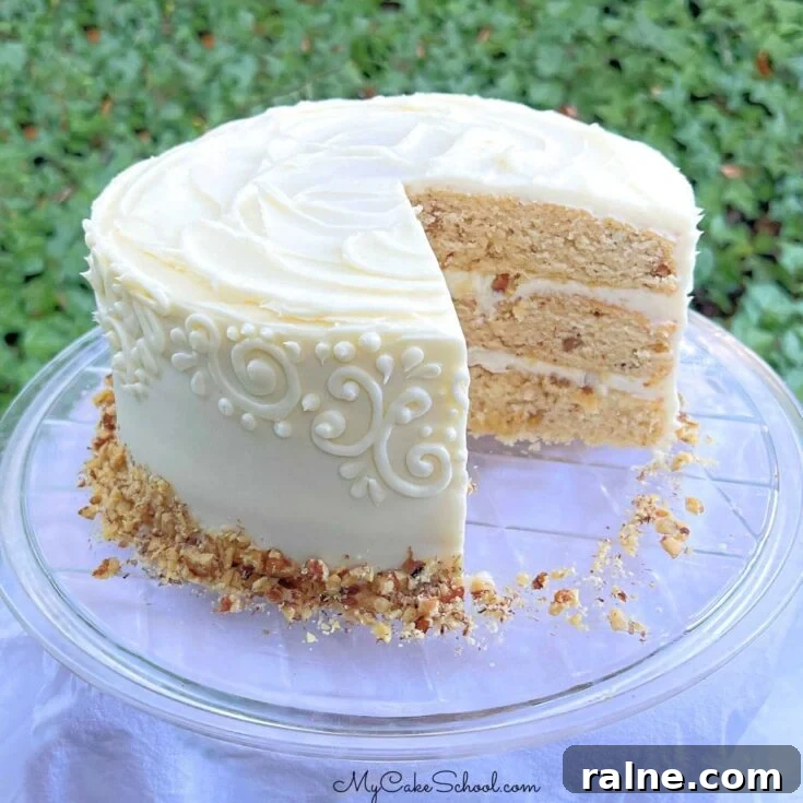 Maple Walnut Cake, sliced, on a cake plate.