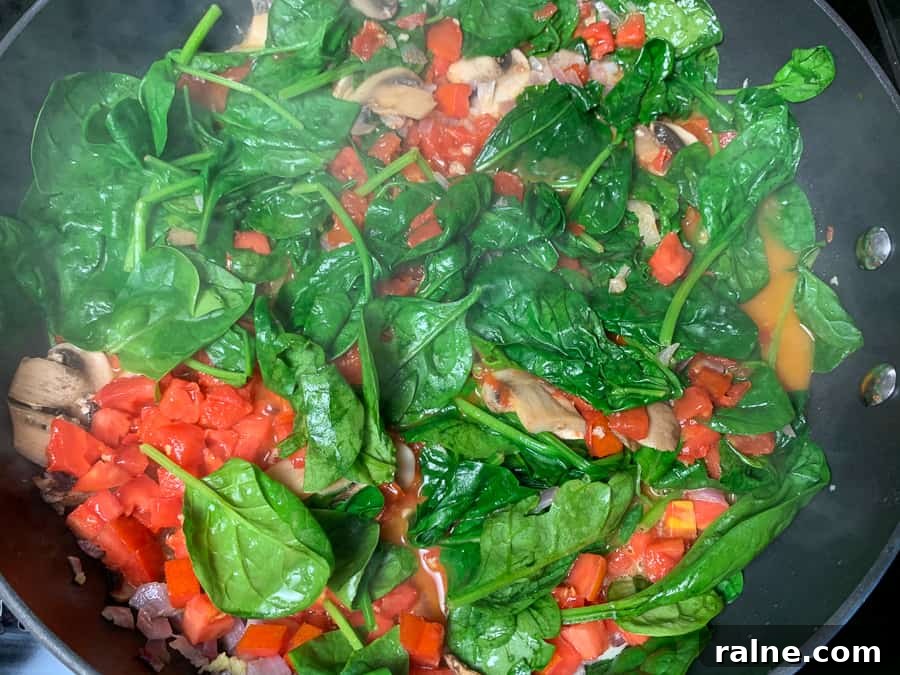 Vegetables sautéing in a skillet