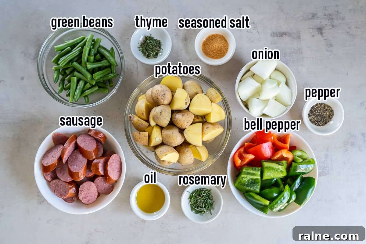 Sausage, potatoes, bell peppers and other ingredients in bowls with text.