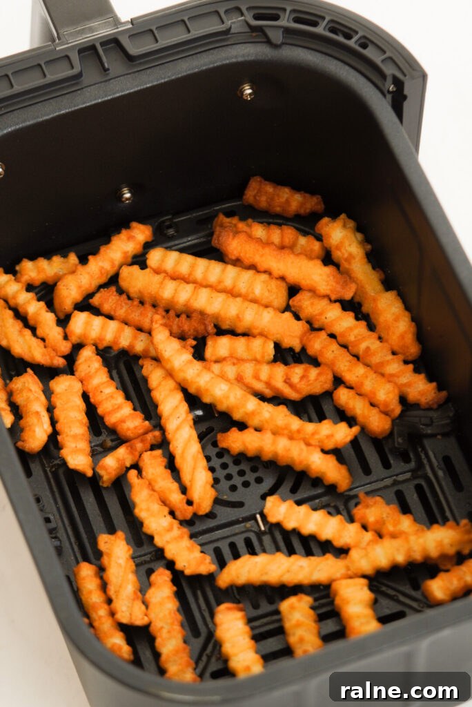 Frozen crinkle cut fries in the air fryer after cooking